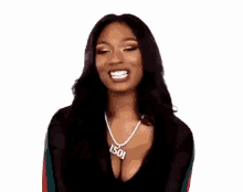 a woman wearing a necklace with the number 1501 on it is laughing