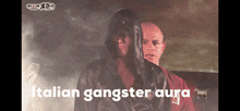 a man in a hooded jacket is standing next to another man with the words italian gangster aura written on the bottom
