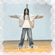 a girl is standing on a wooden floor with her arms outstretched and a lace frame around her .
