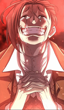a man with red hair is crying and smiling with tears running down his face