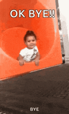 a little girl is sitting on an orange slide and the words ok bye are above her