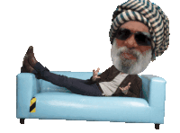 a man wearing a turban and sunglasses is laying on a couch