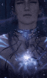 a close up of a person 's face with a blue light coming out of it