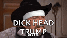 a man in a cowboy hat with a bandage on his head is talking about trump .