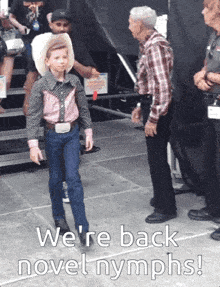 a young boy in a cowboy outfit says we 're back novel nymps