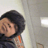 a person wearing a sweatshirt that says ' snkr ' on it