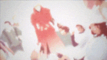 a group of people are standing around each other in a room with a red and white background .