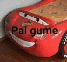 a bed made to look like a lightning mcqueen car with a face on it .