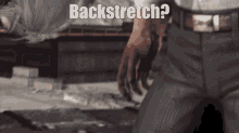 a man in a suit is kneeling down with the words backstretch written on the bottom
