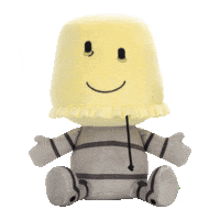 a stuffed animal with a smiley face on it 's head