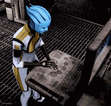a video game character with a blue head is standing in front of a computer