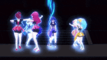a group of anime girls are dancing on a stage with glowing lights .