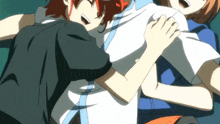 a man with red hair is hugging another man