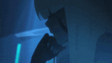 a close up of a person 's face in the dark