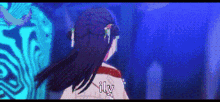 a pixel art of a woman standing in front of a blue wall with the words `` ily '' written on it .