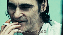 a man smoking a cigarette with the words you would n't get it