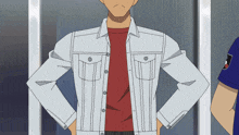a man with his hands on his hips is wearing a white denim jacket