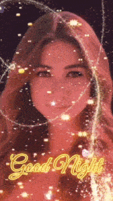 a woman 's face is surrounded by sparks and the words `` good night '' .