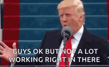 donald trump is speaking into a microphone and saying guys ok but not a lot working right in there