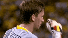 a man wearing a jersey with the name vincent on the back