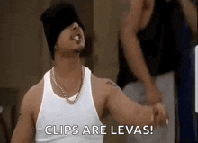 a man wearing a white tank top and a black beanie is saying `` clips are levas '' .
