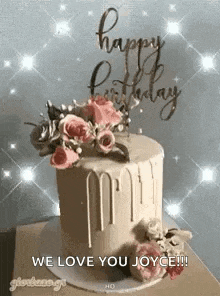 a birthday cake with flowers on top and the words `` we love you joyce '' .