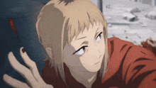 a girl with blonde hair and red nails is wearing a red shirt