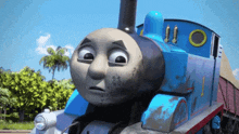 a close up of a thomas the tank engine with the number 1 on the side