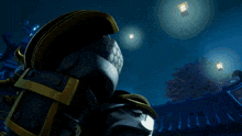 a close up of a robot with red eyes and a yellow helmet