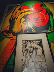 a framed copy of avengers behold the vision comic