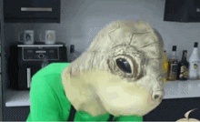 a person in a green shirt is wearing a mask