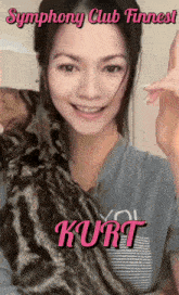 a woman holding a cat with the name kurt on the bottom right