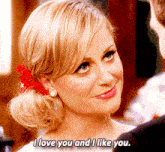 a woman with a red flower in her hair says i love you and i like you