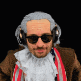 a man wearing a wig and sunglasses has headphones on