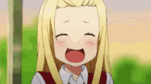 a girl with long blonde hair is smiling with her mouth open .