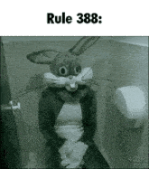 a woman in a bunny costume is sitting on a toilet .