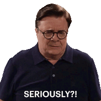 a man wearing glasses and a blue shirt says seriously ?