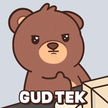 a brown teddy bear with the words gud tek written on it