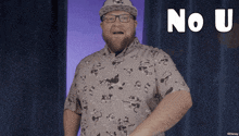 a man wearing glasses and a hat says " no u " in white letters