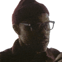 a man wearing glasses and a beanie is asking to get it