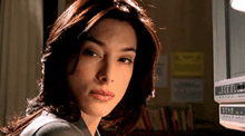 a close up of a woman looking at the camera