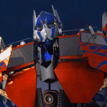 a close up of a robot 's head with the word optimus on it