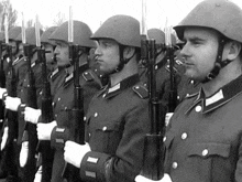 a black and white photo of a group of soldiers