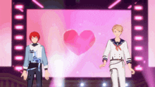 a couple of anime characters standing on a stage with a heart in the background