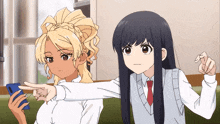 two anime girls are sitting next to each other and one is pointing at the other