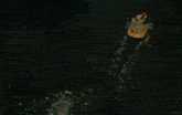 a woman in a yellow jacket is sitting on a raft in a river