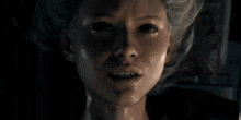a close up of a person 's face with their mouth open and their eyes closed