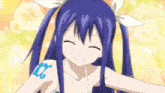 a girl with blue hair has a tattoo on her shoulder that says ix