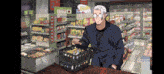 a man in a suit is standing in a store with a sign that says 2 for 2