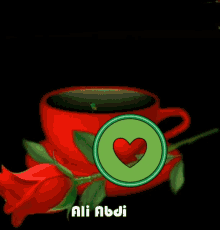 a red cup with a green circle with a heart in it and the name ali abdi on the bottom